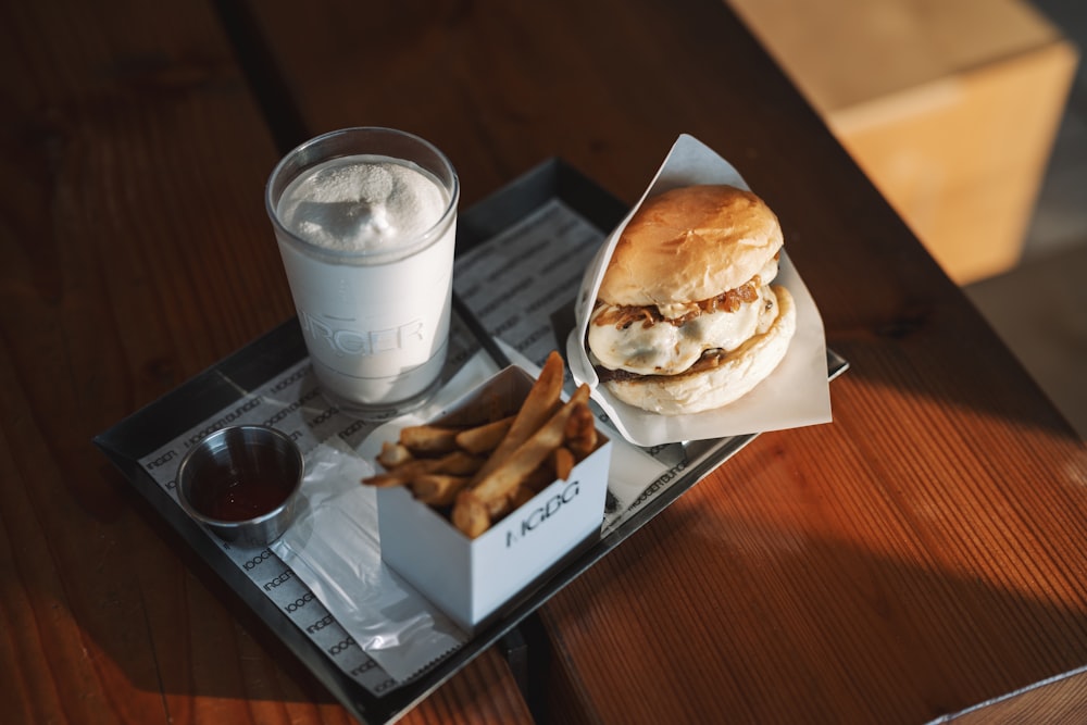 a burger and fries on a tray