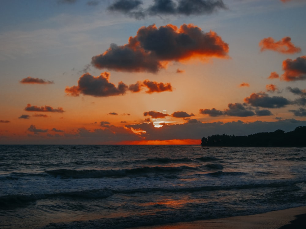 a beach with a sunset