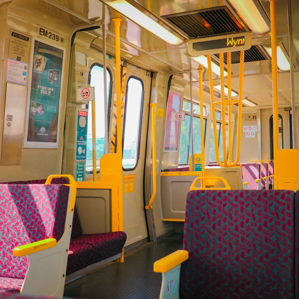 a train with yellow and blue seats