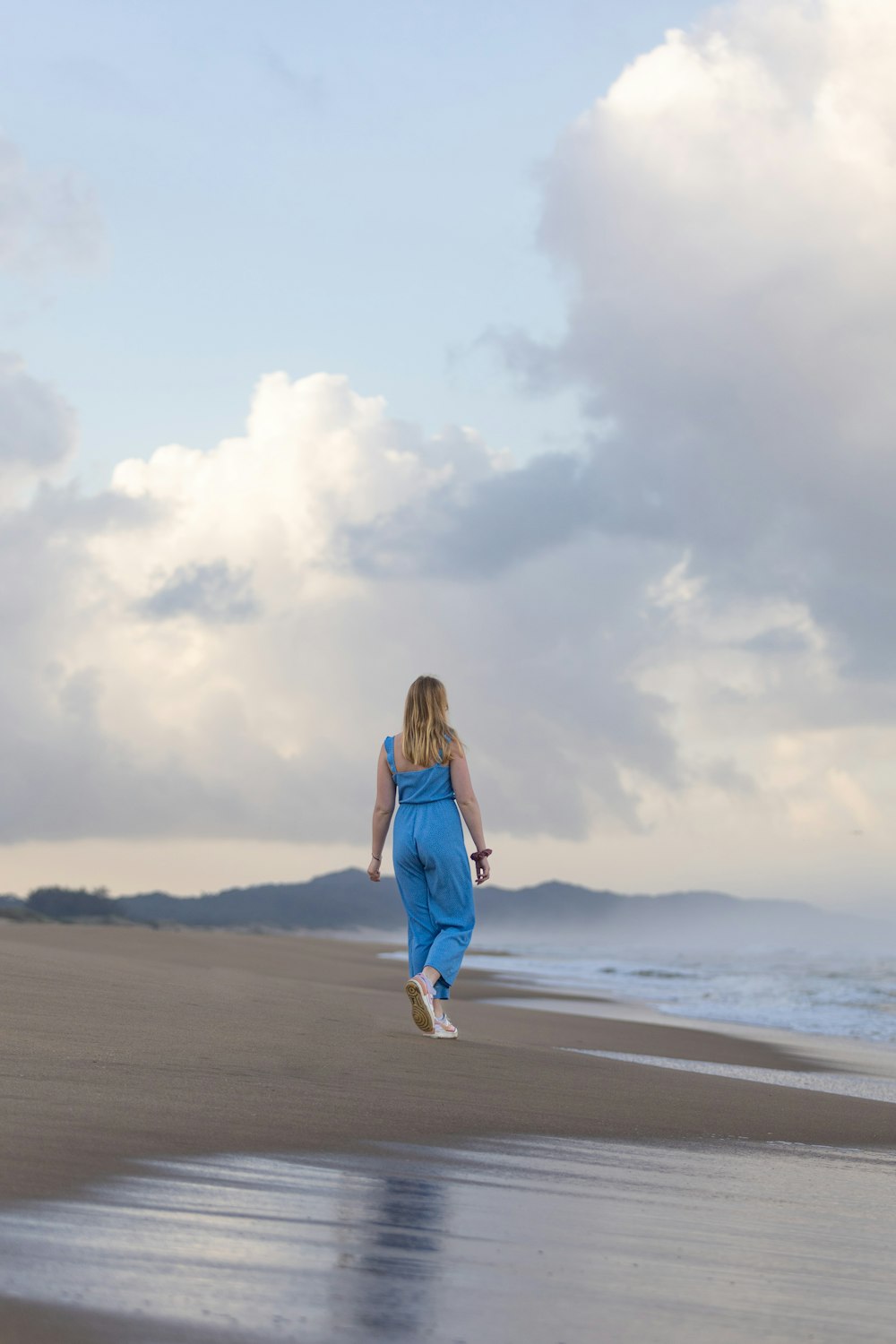 a person walking on a beach