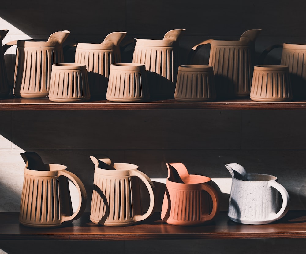 a shelf with teapots on it