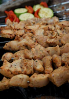 Grilled skewers of marinated chicken and vegetables served with fragrant rice.
