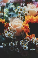 A vibrant birthday centerpiece with bright sunflowers and daisies.