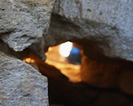 Close-up of a newly restored stone wall with soft natural light filtering through a window.