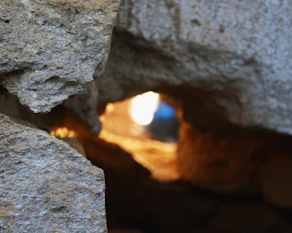 Close-up of a newly restored stone wall with soft natural light filtering through a window.
