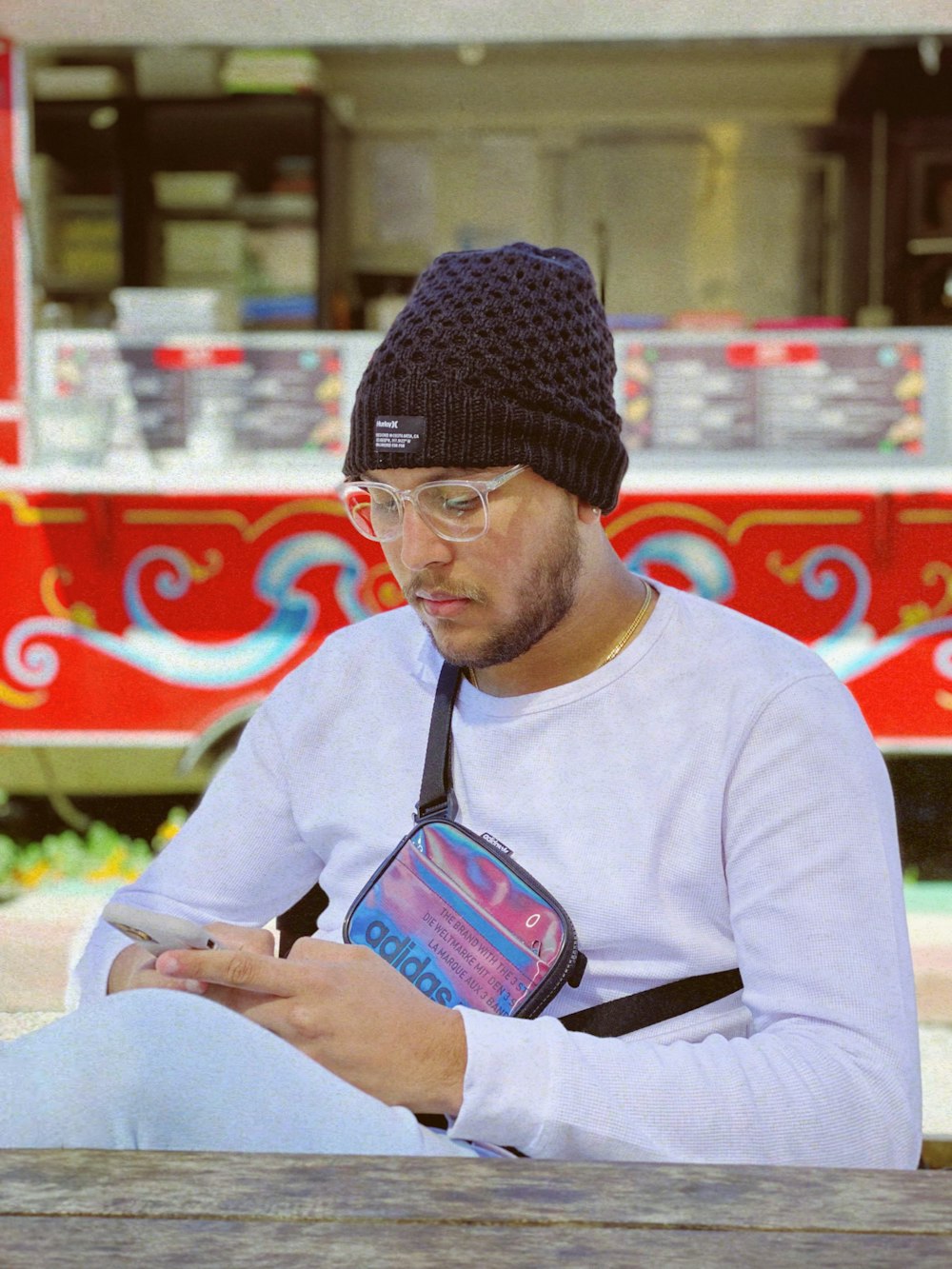 a man wearing a hat and glasses