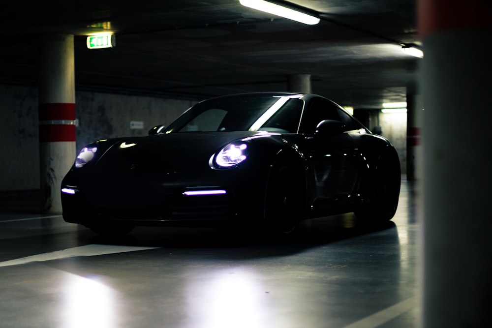a black sports car in a parking garage