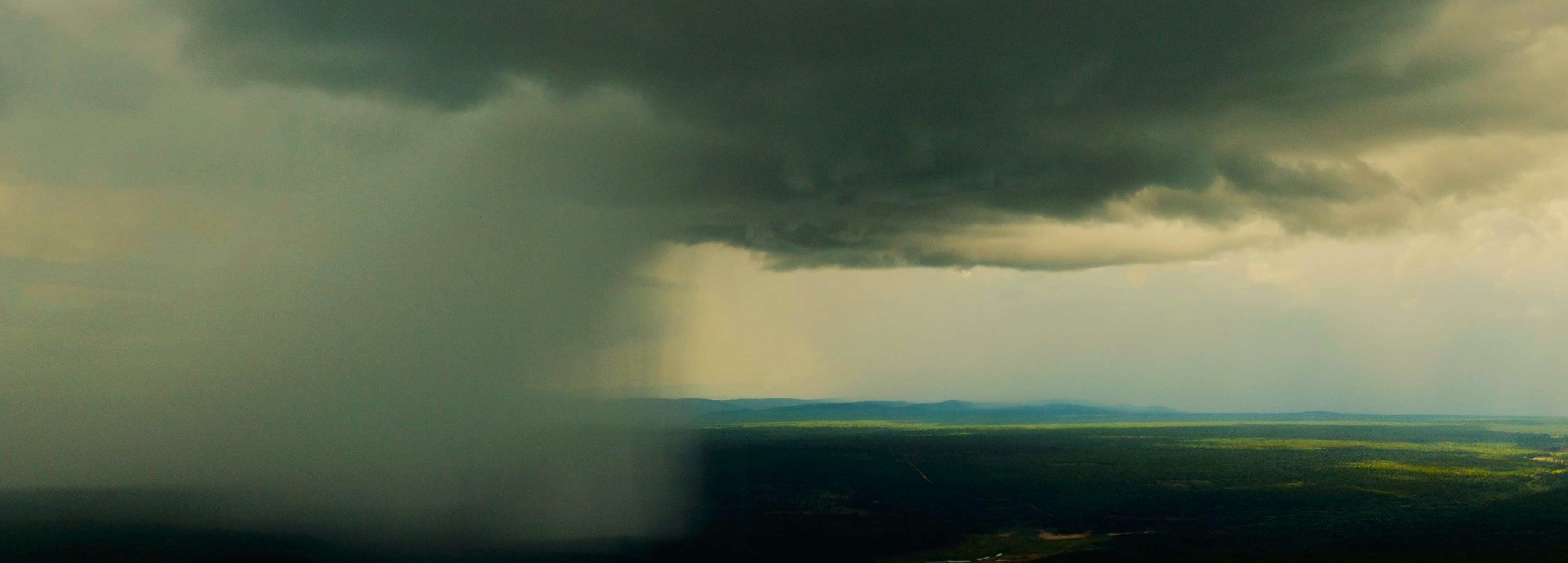 a landscape with a cloudy sky