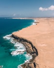 a beach with blue water