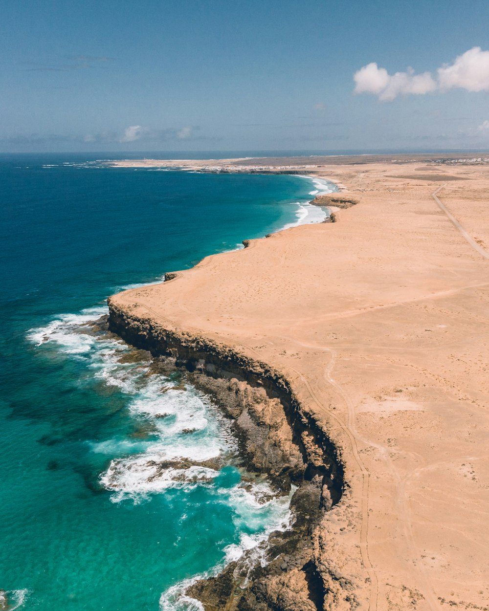 a beach with blue water