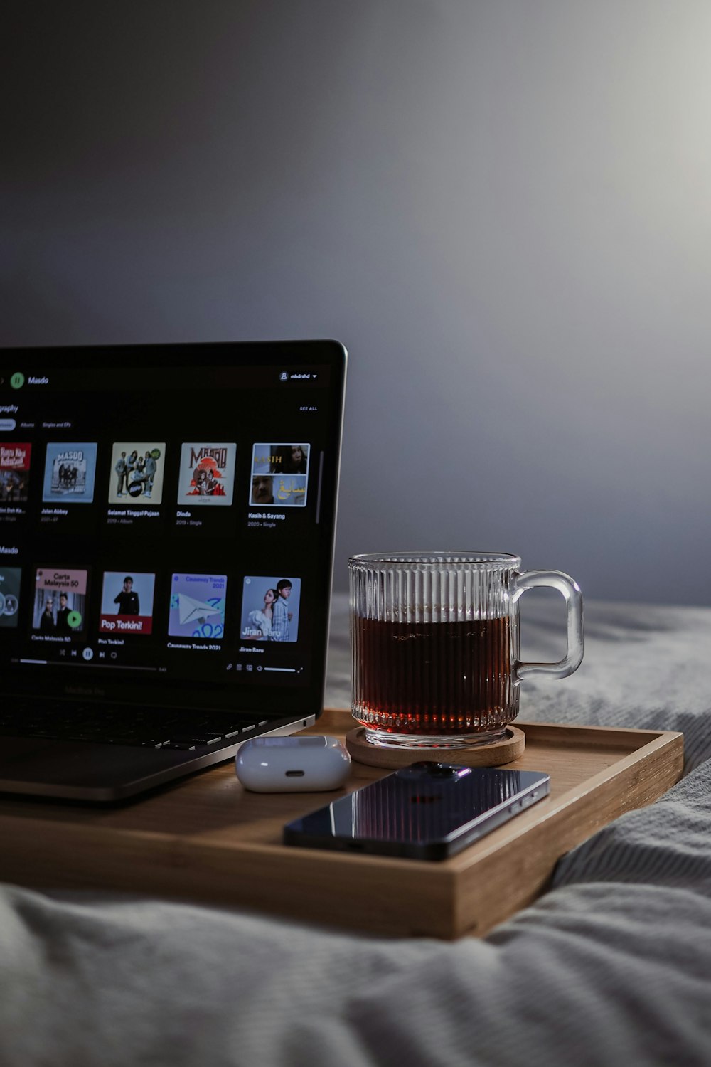 a mug of coffee next to a laptop