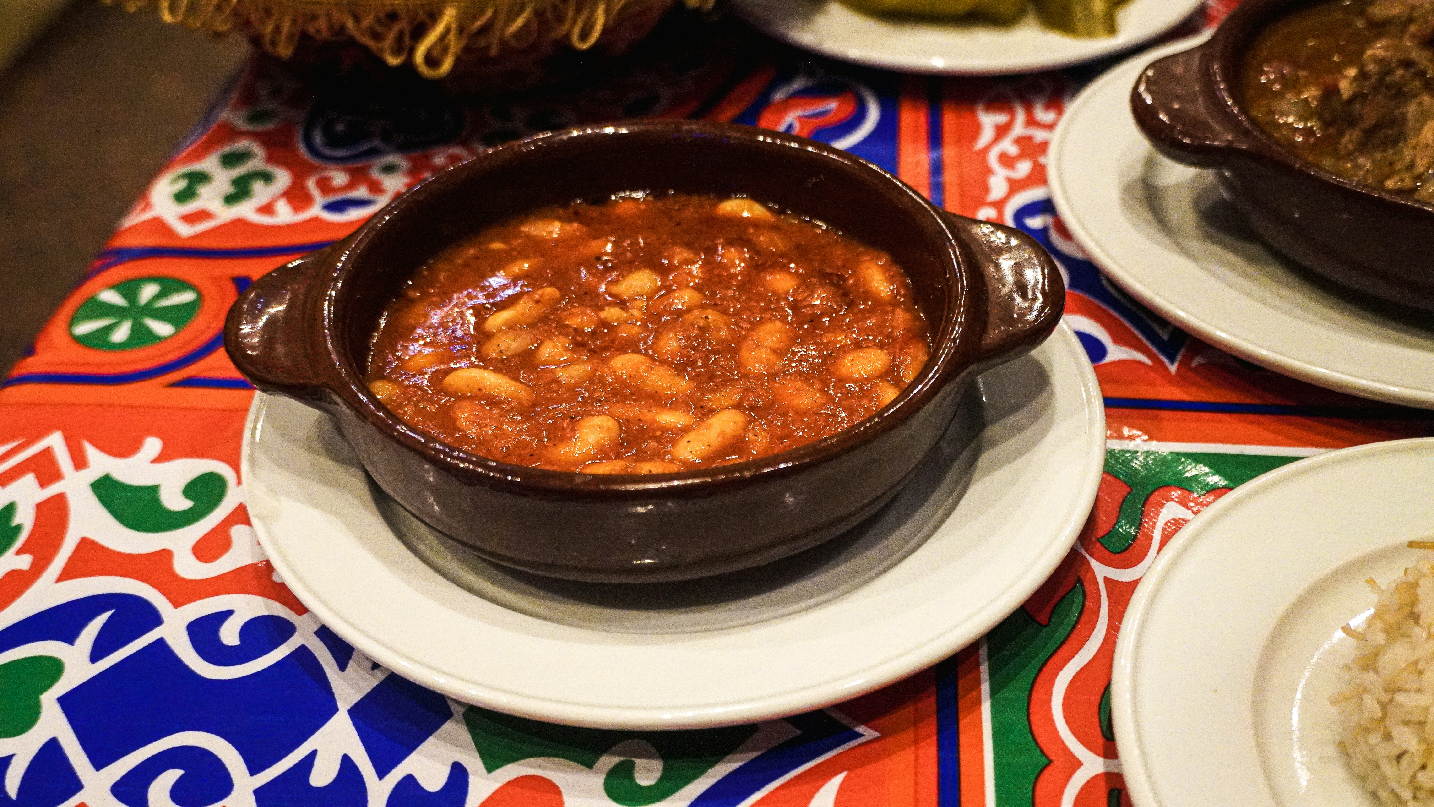 Plain stewed beans in white bowl