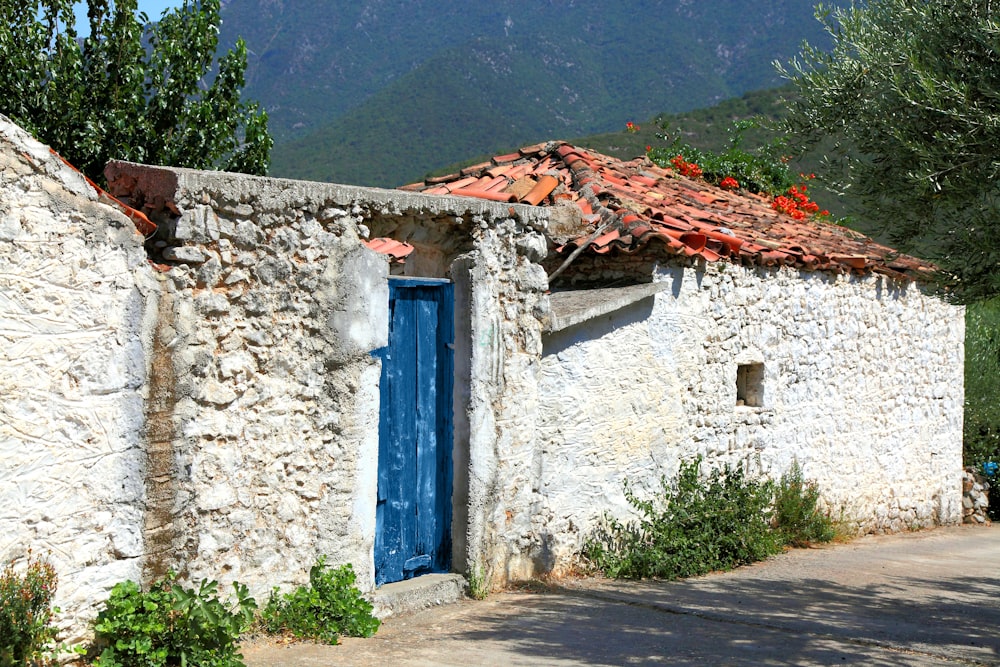 a stone building with a blue door