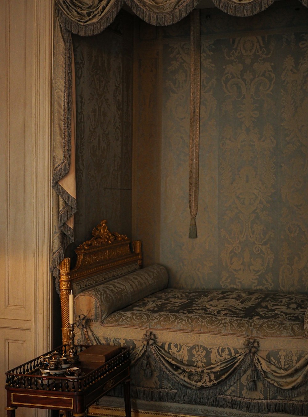 a bed with a decorative headboard