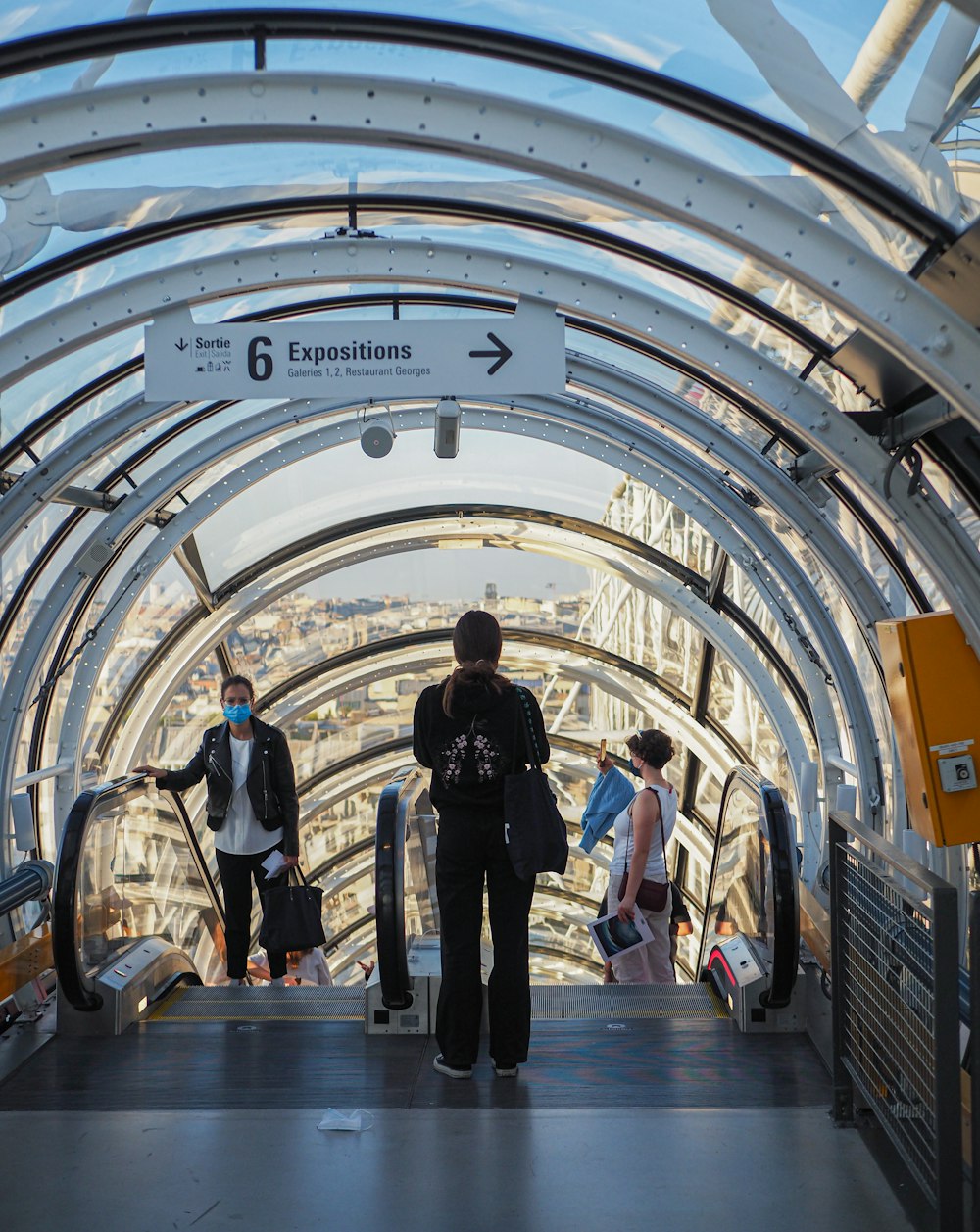 people with luggage in a train station