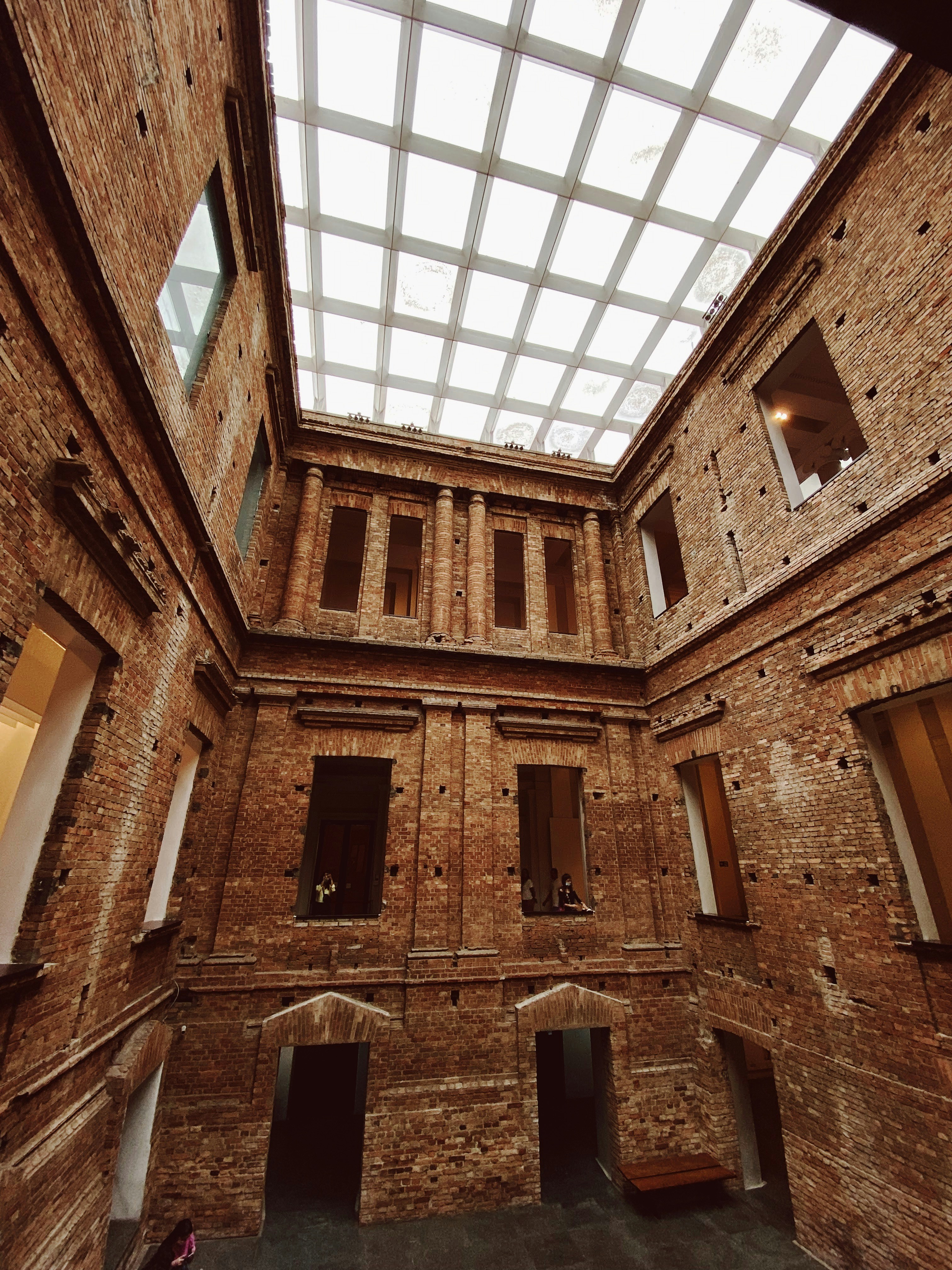 a building with windows and a large arched doorway