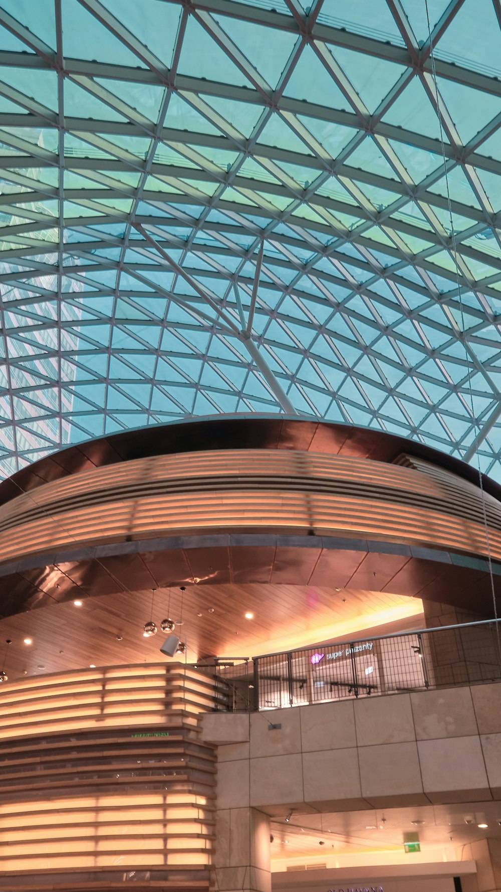 a large glass ceiling with a large glass dome