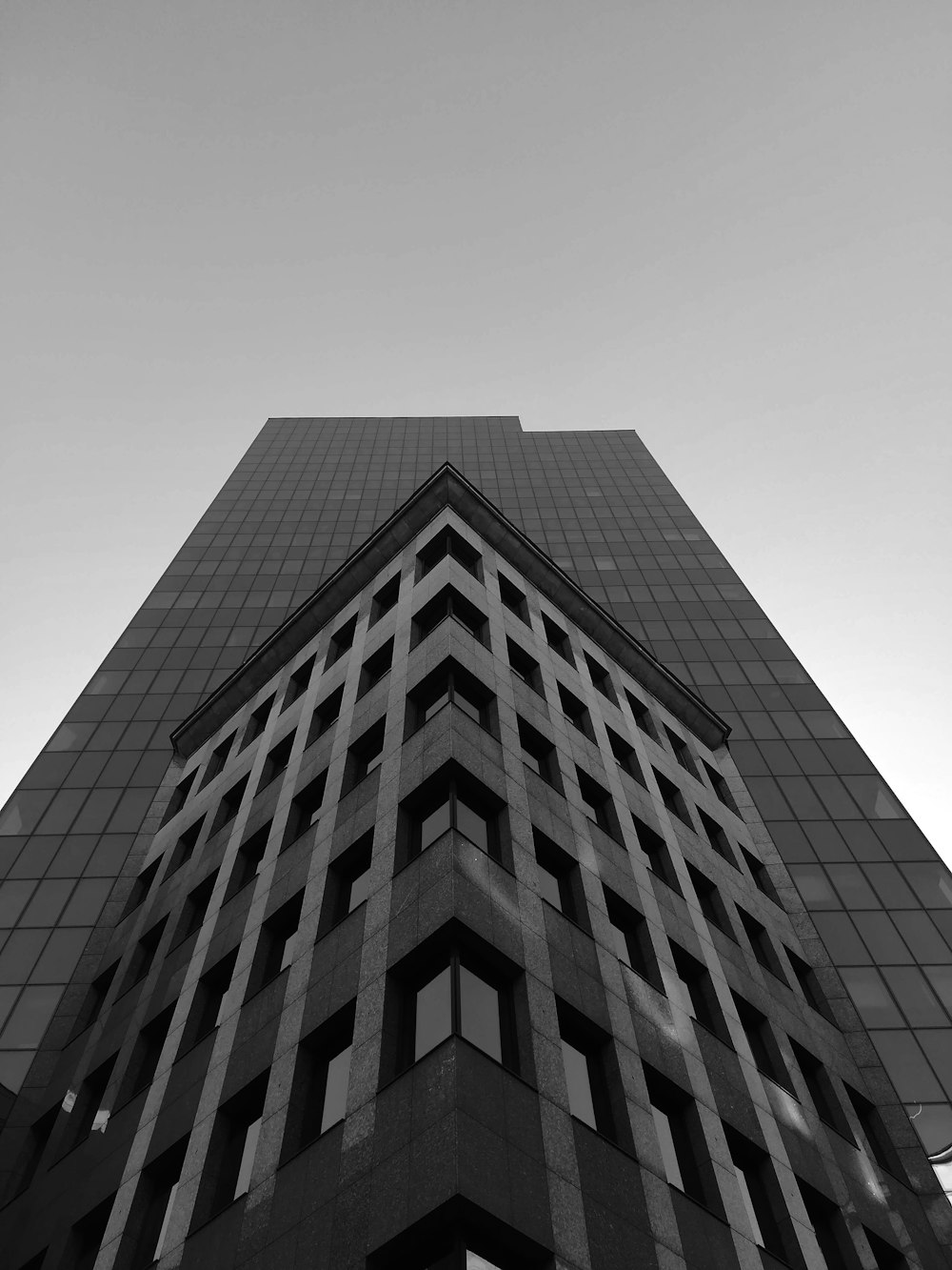 a tall building with a cloudy sky