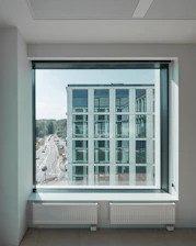 Modern office building with integrated smart climate control systems visible through glass walls