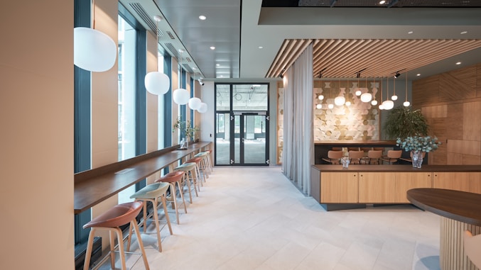 a room with a bar and stools