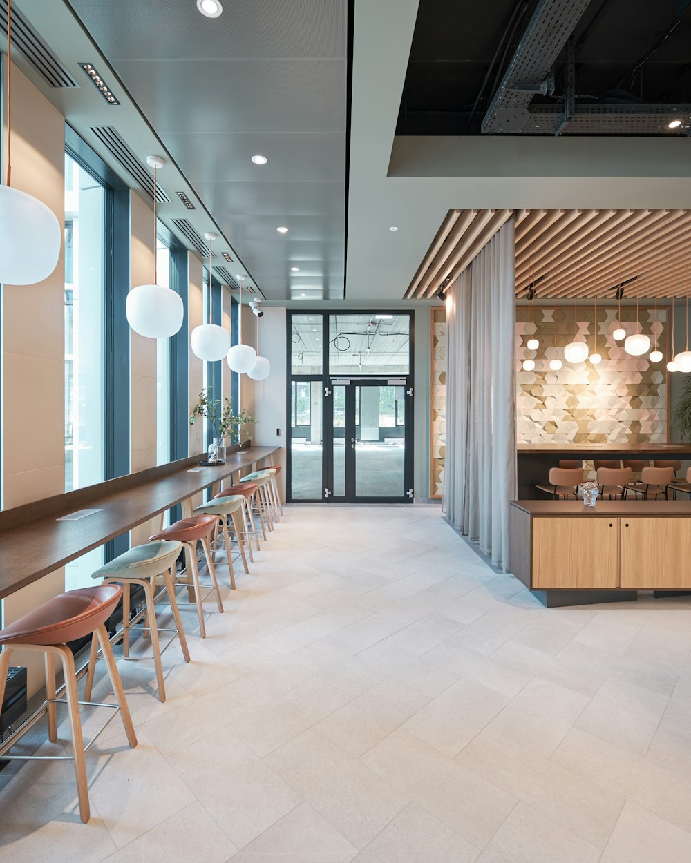 a room with a bar and stools