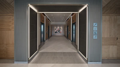 Smart home automation panel installed in a stylish hallway.