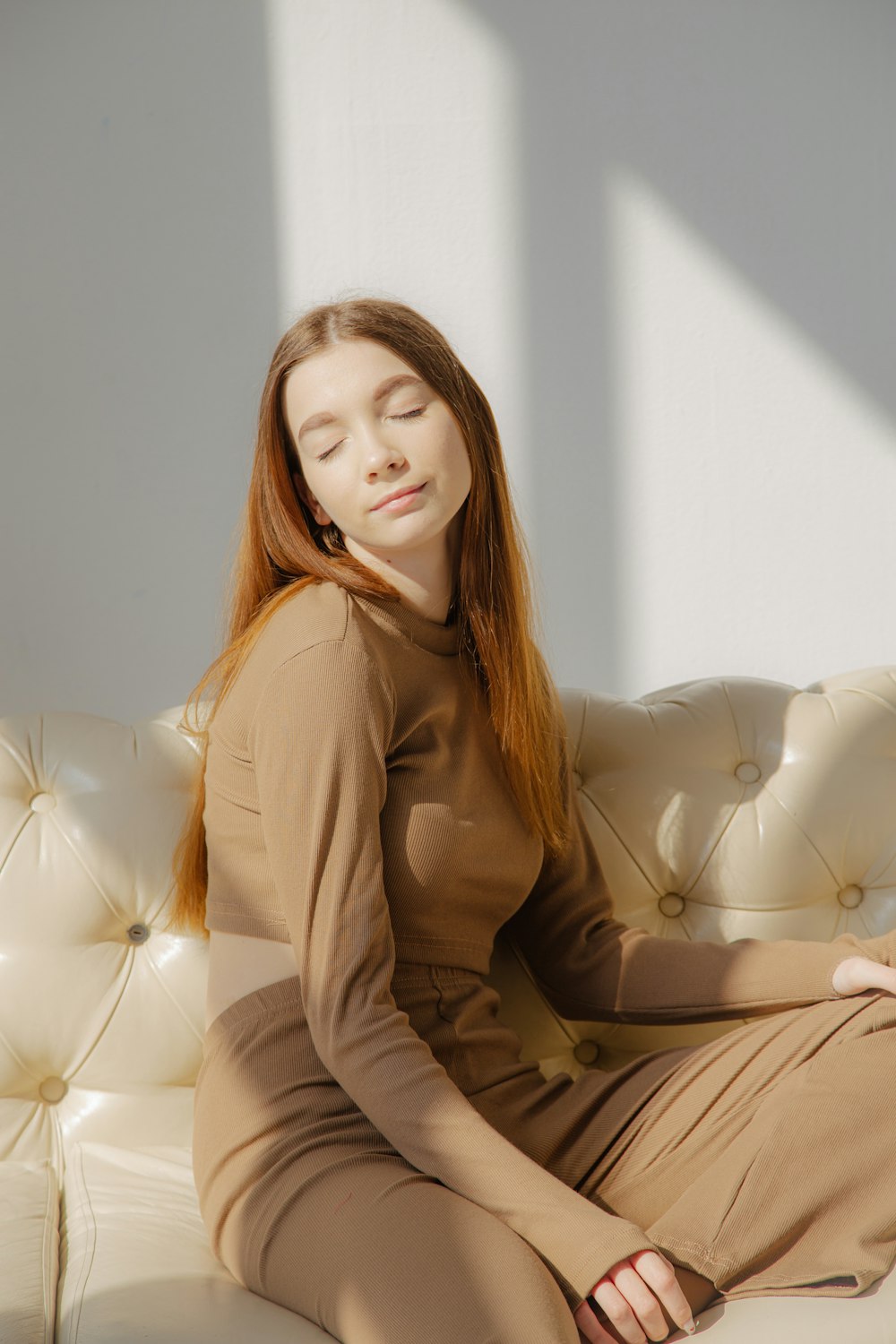 a woman sitting on a bed