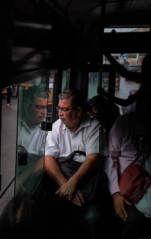 A friendly driver checking his vehicle before a trip in Coimbatore.