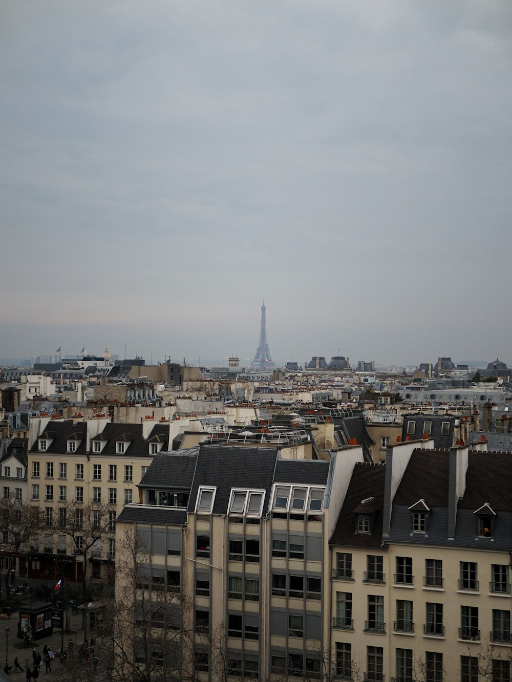 a city with buildings and a cloudy sky