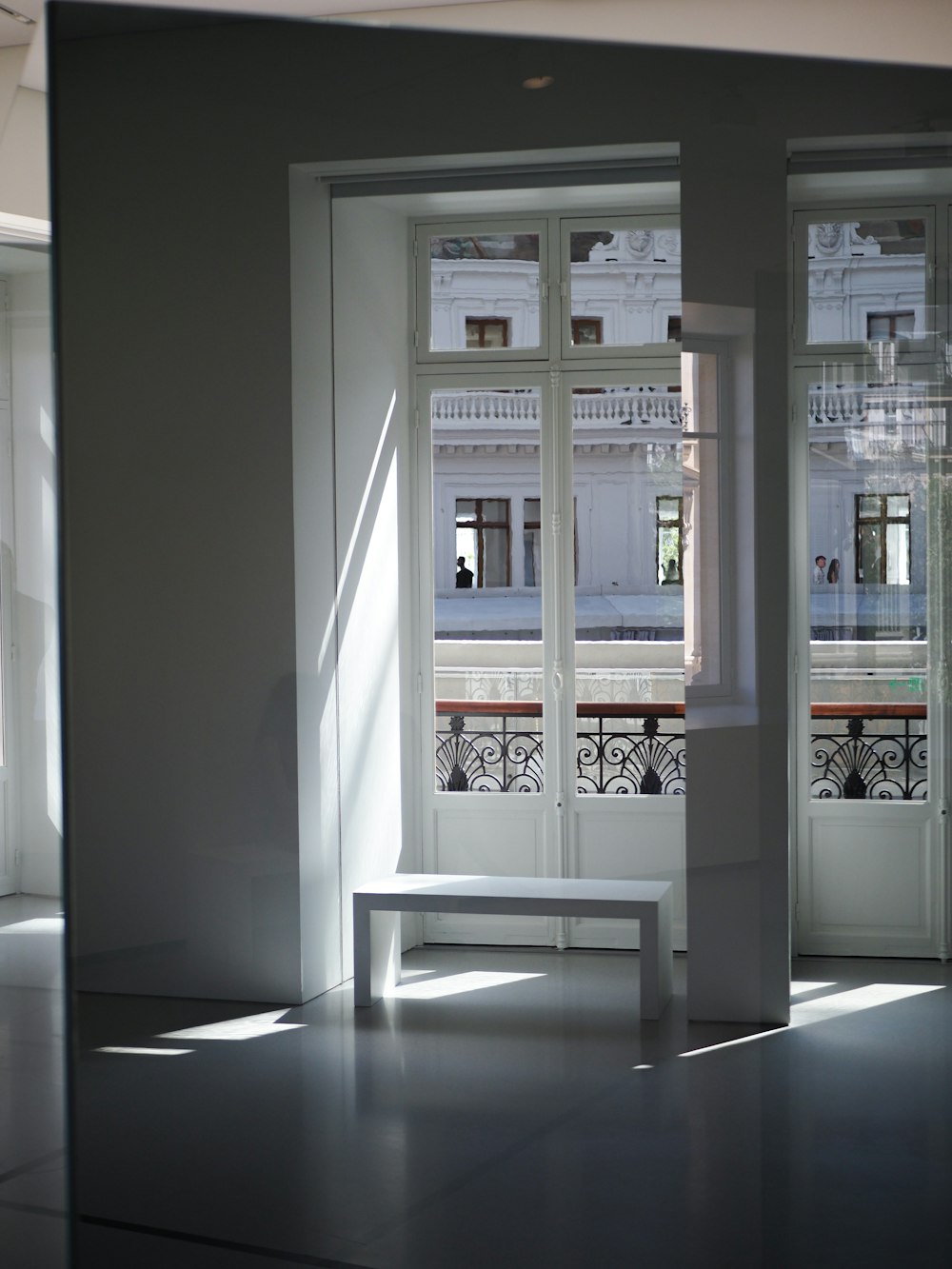 a white door with a bench