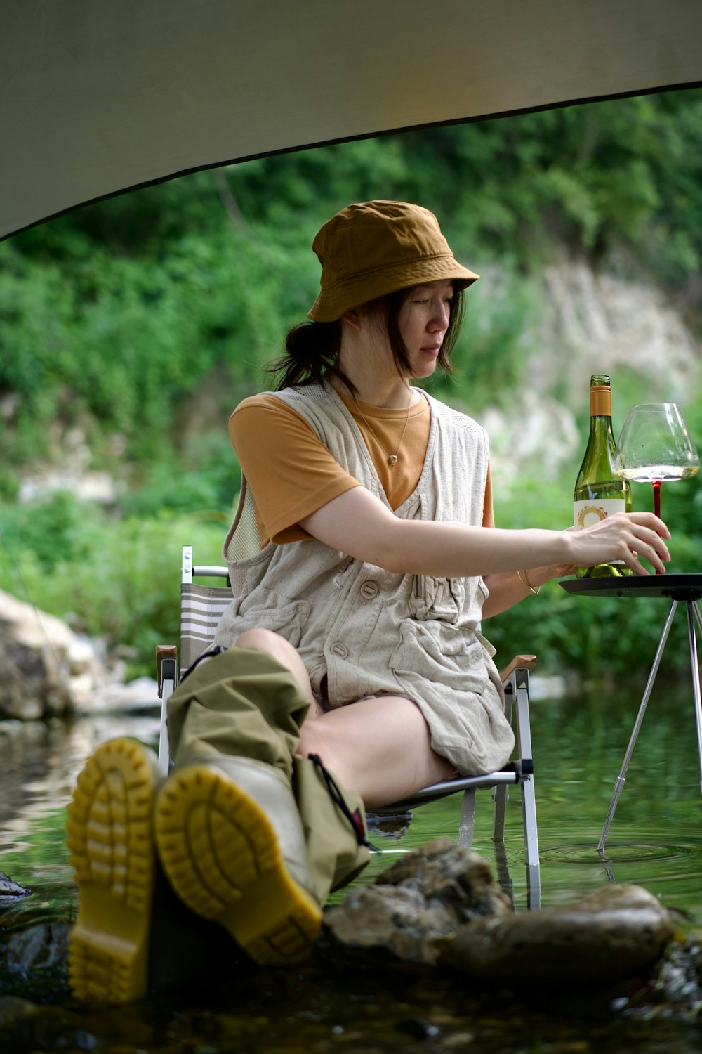 a person sitting under an umbrella