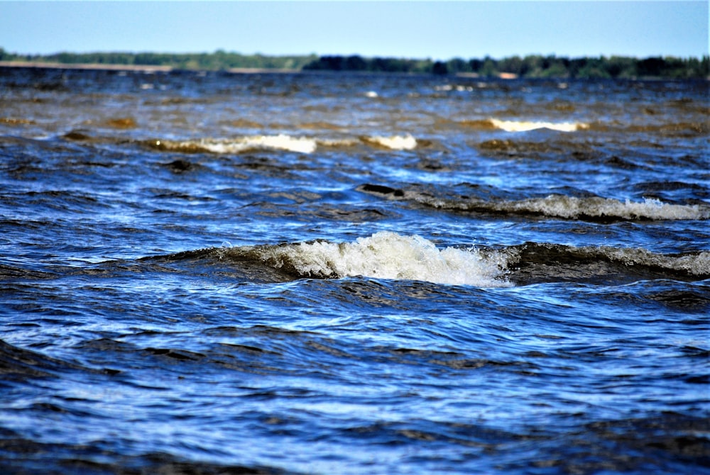 a body of water with ice and snow on it