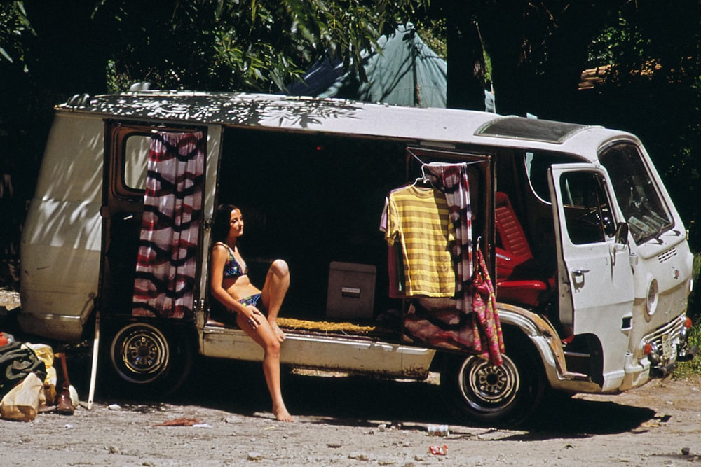 a person sitting in a camper