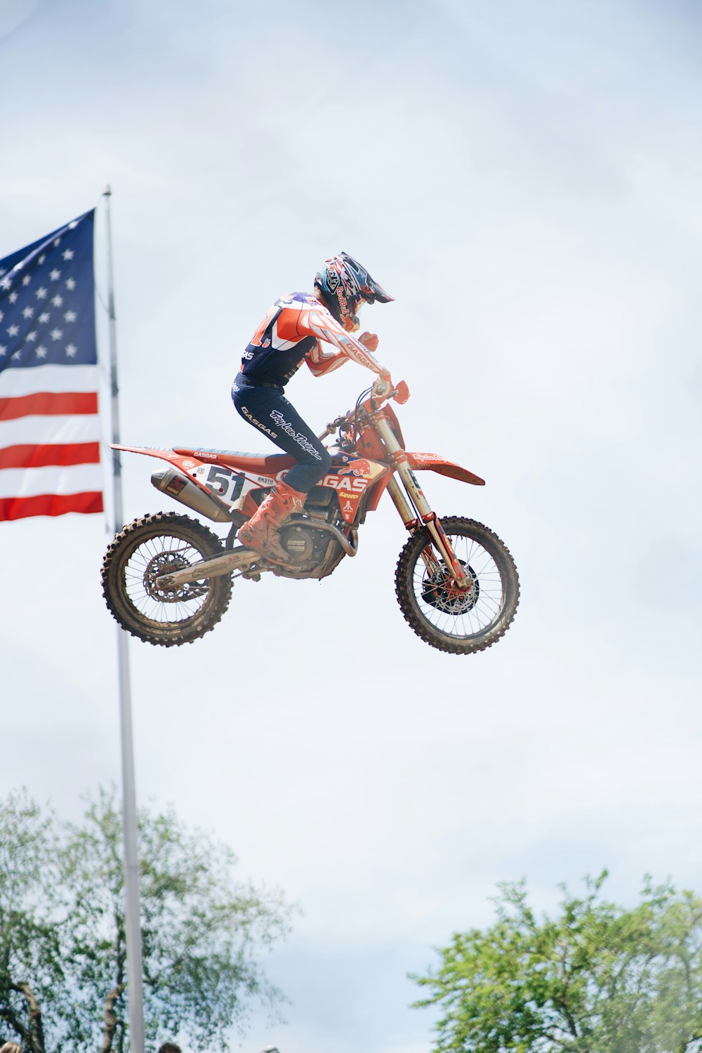 a man doing a trick on a motorcycle