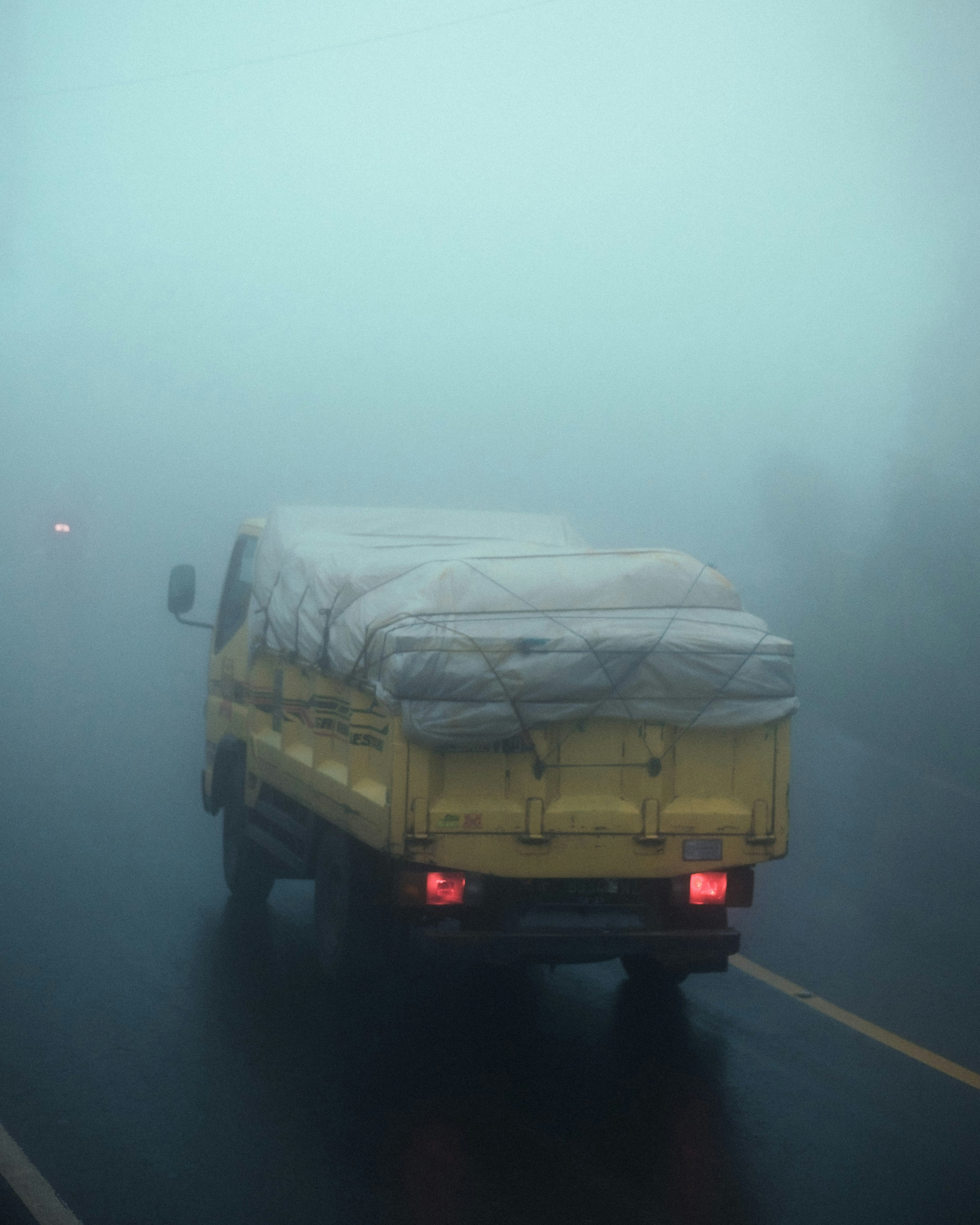 a truck driving on a road