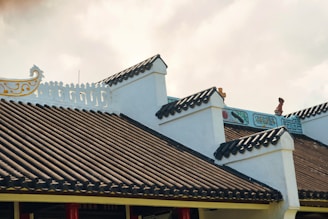 a building with a dragon on the roof