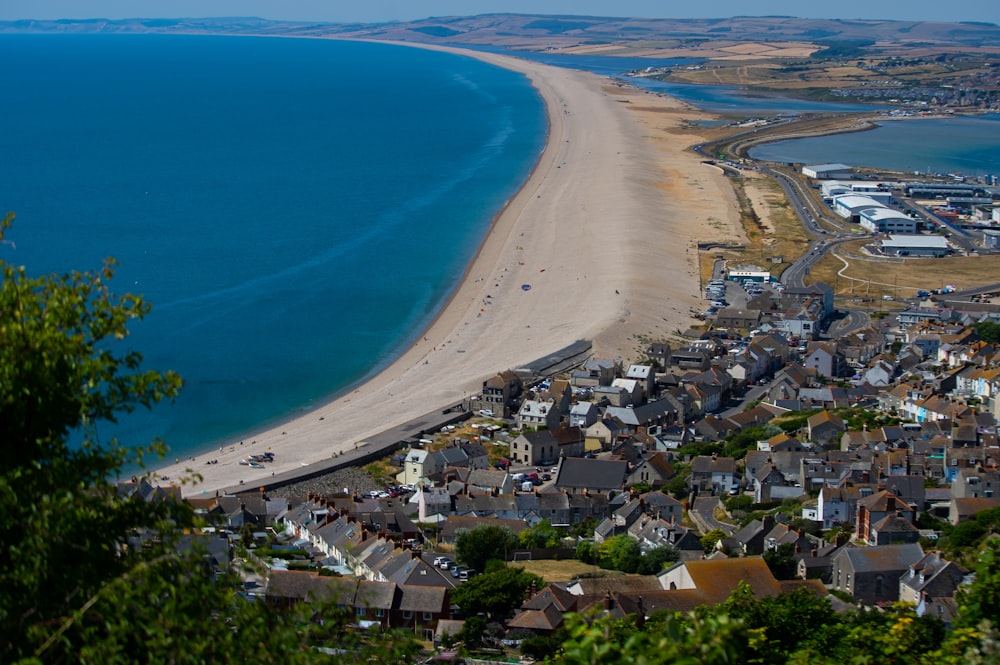 a beach with houses and water