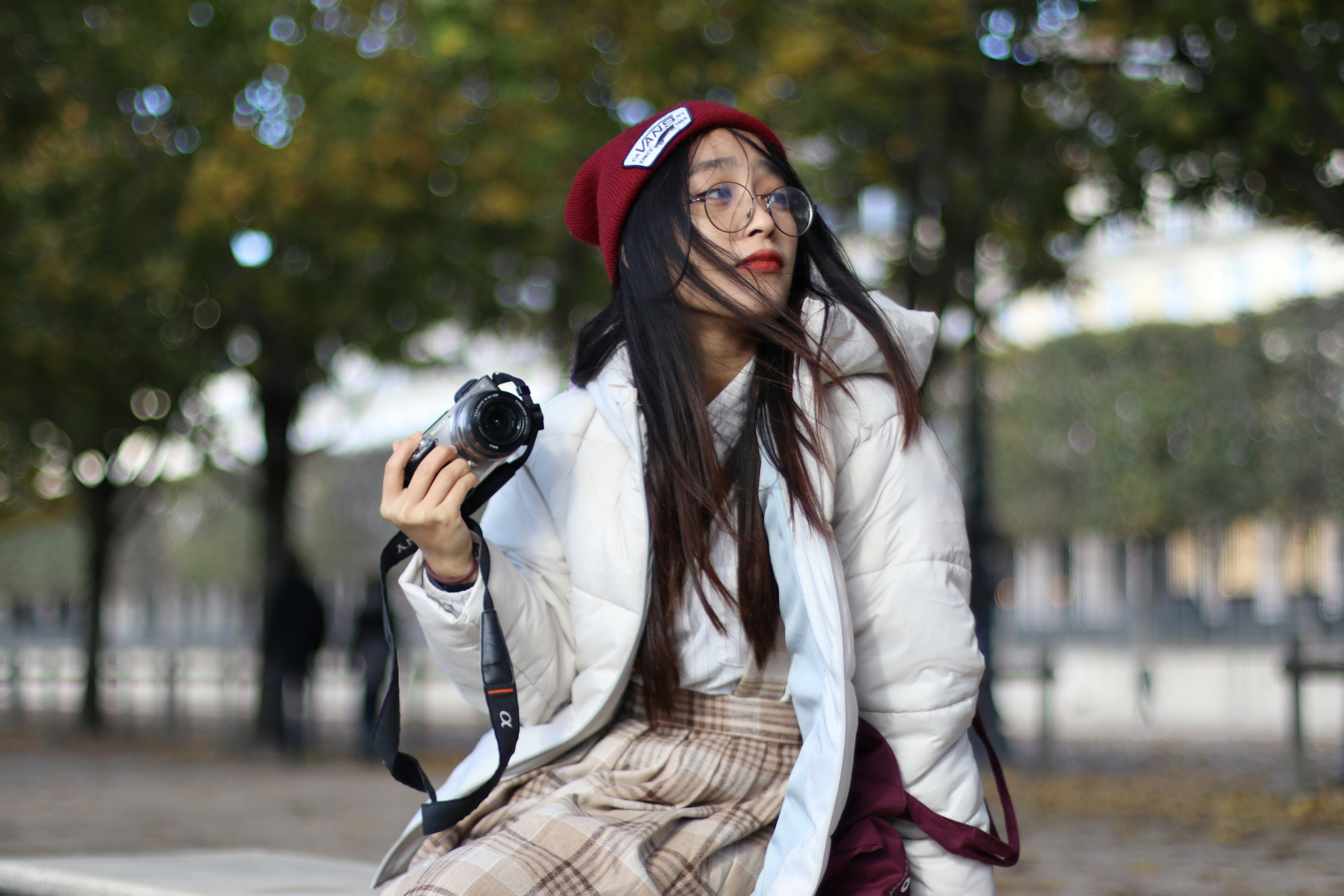 a woman holding a camera