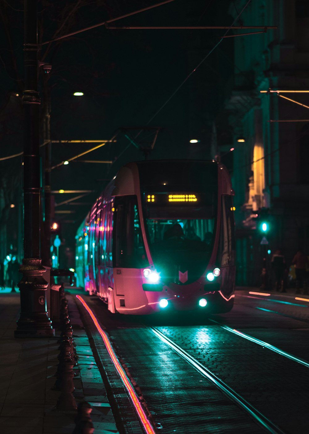 a trolley on a street at night