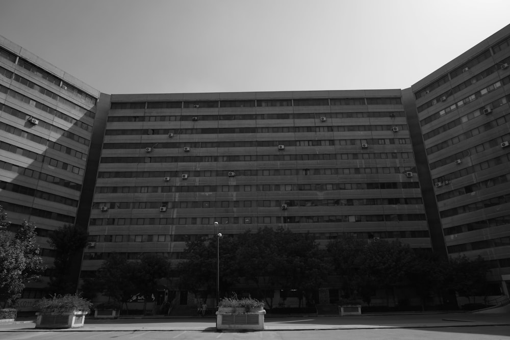 a large building with trees in front of it