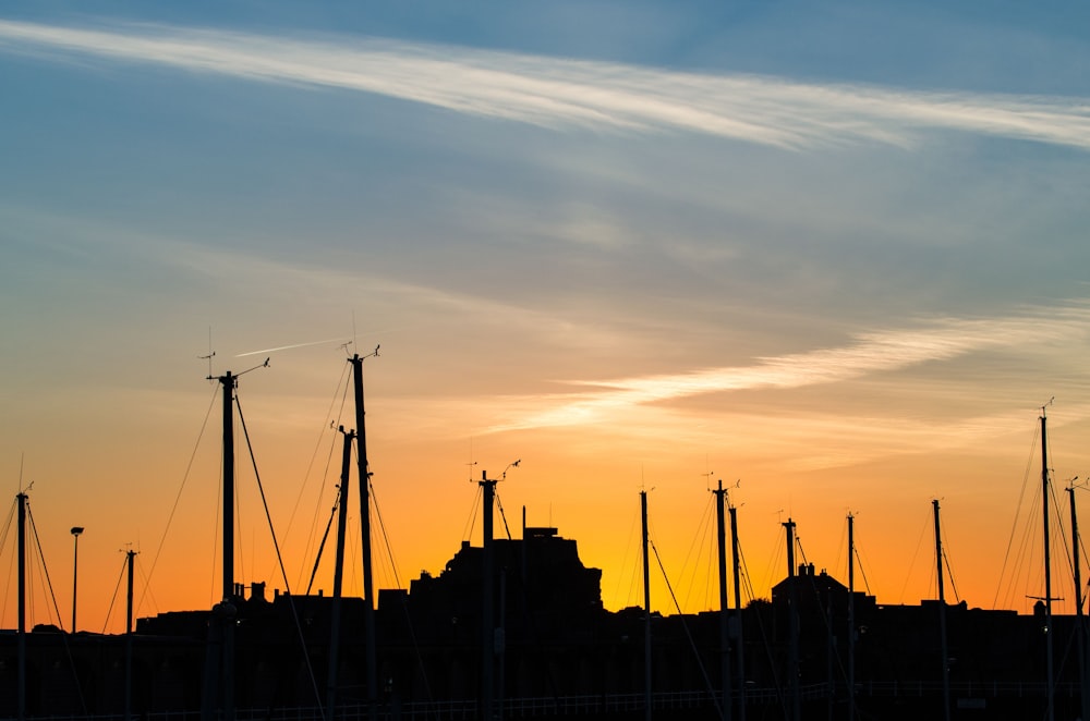 a row of masts and masts of a ship