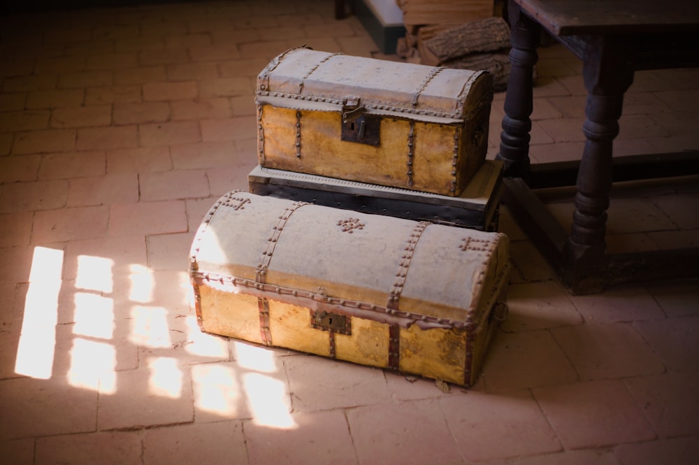 a couple of suitcases on a tile floor