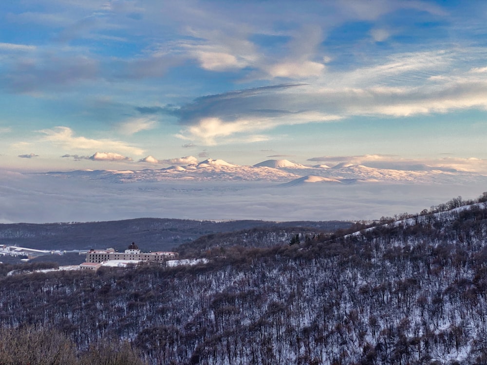 a landscape with snow and trees