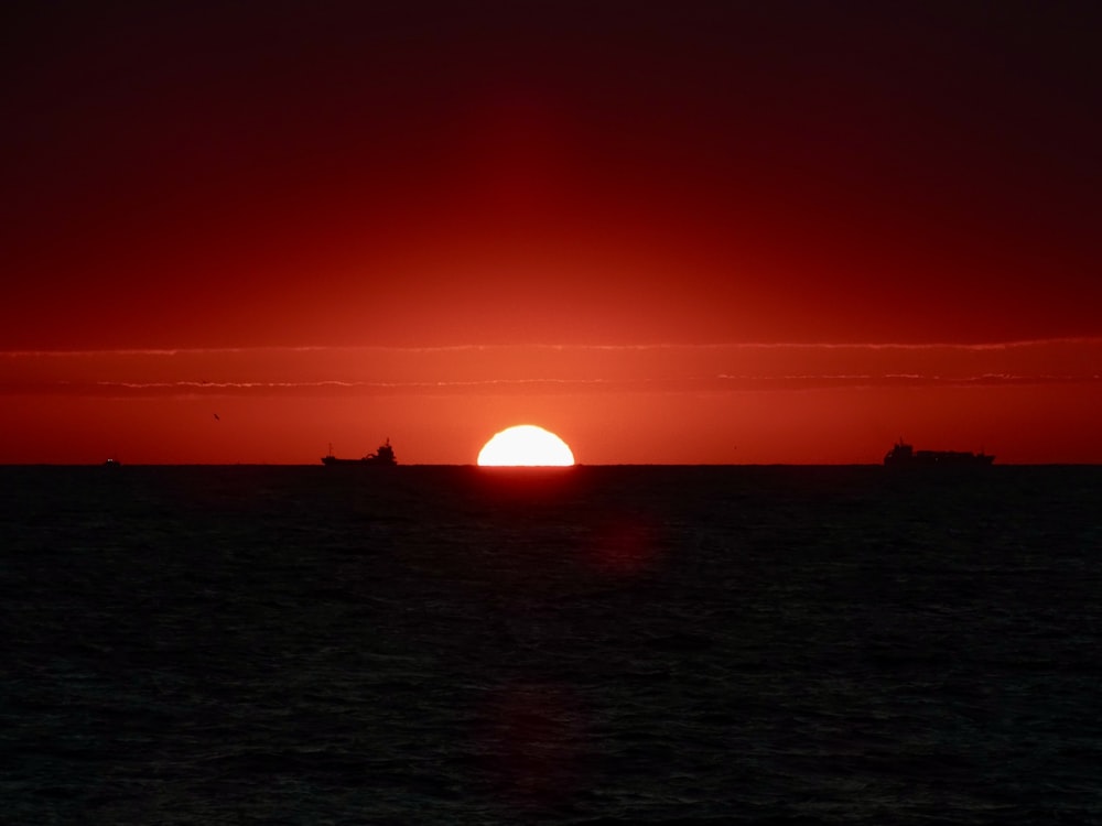 a sunset over a body of water