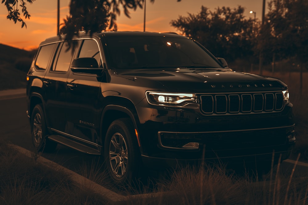 a black car parked on a road