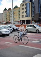 Viker biking down a winding road with headphones on, lost in music