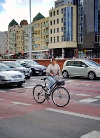 Close-up of a cyclist wearing osseo wave headphones on a sunny road.