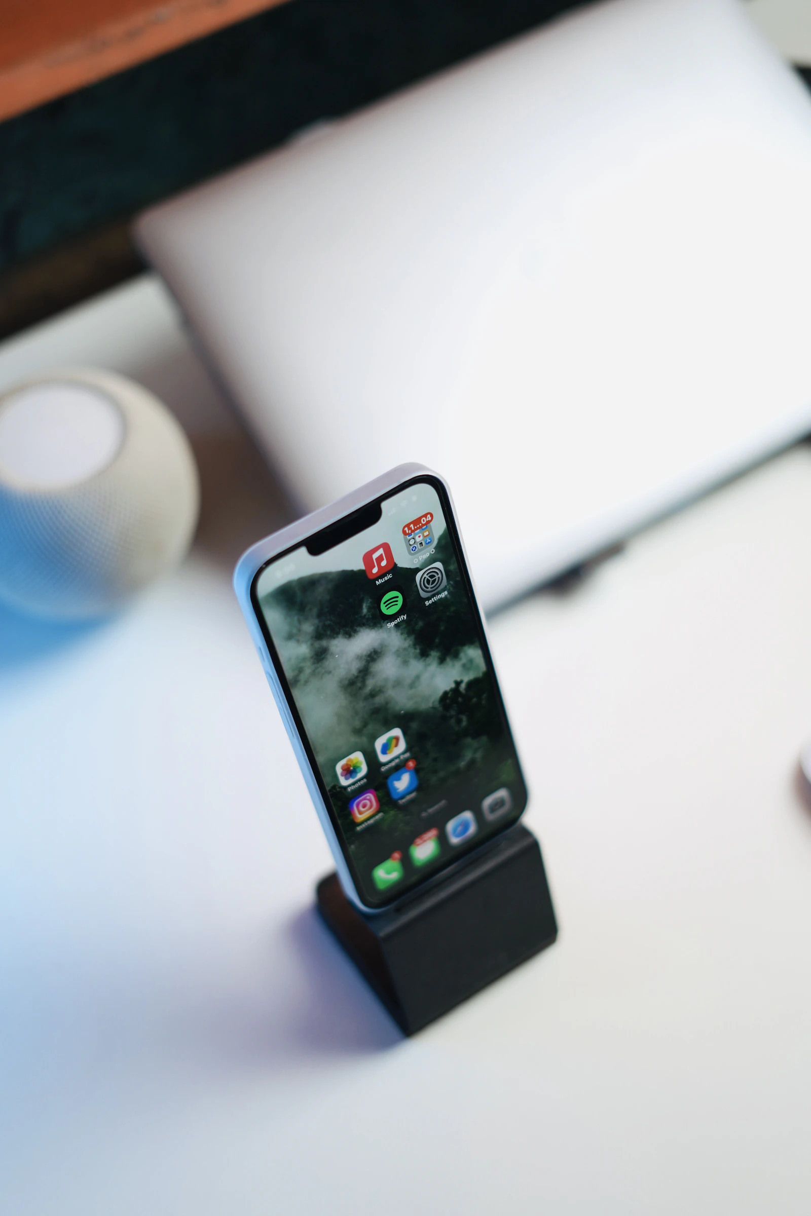 Smartphone positioned upright on a modern desk
