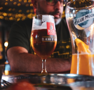 man serving beer at restaurant