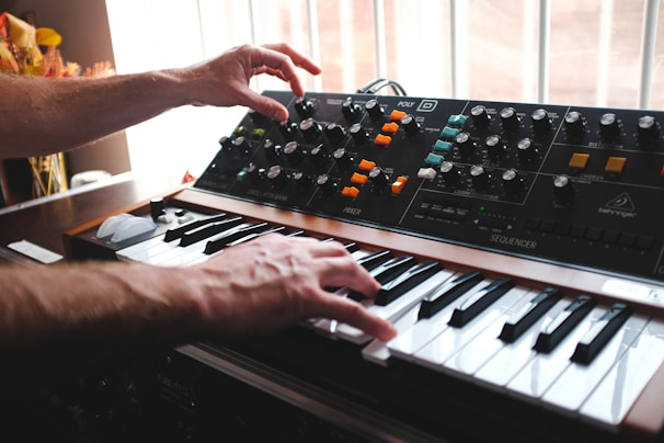 hands playing a piano